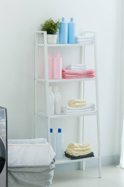 istock Stack of towels and laundry detergent. Stack of towels and detergent. Stack of clean towels and detergent on washing. 1351059978