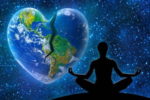 istock Yoga Figure Against Broken Heart Shape Earth in Space 1351060029