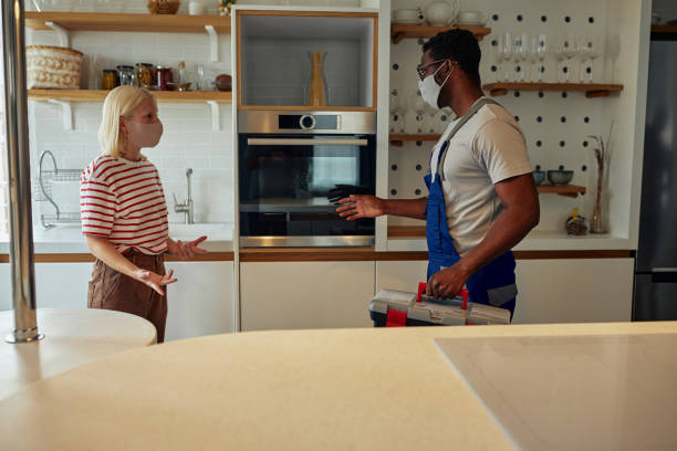 istock Black male plumber at work with caucasian customer 1351061682