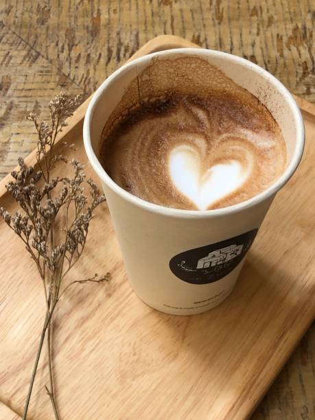 Heat latte art on coffee cup in restaurant
