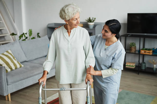 istock Senior Woman using Walker at Home 1351063577