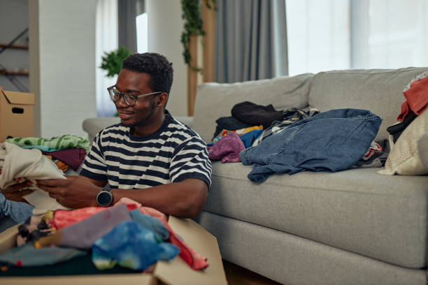 istock Man donating clothes for poor people 1351065628