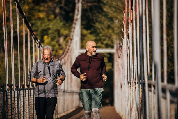 istock Senior men jogging together 1351065765