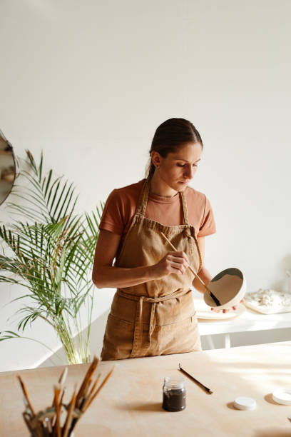 istock Woman in Pottery Studio Minimal 1351066982