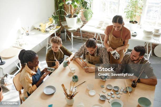 People Creating Pottery in Studio Top View