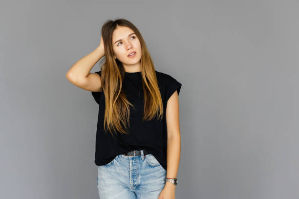 istock Young woman remembered importrant task she forgot, punching herself in forehead, dropping jaw and standing anxious over gray background, gesturing, being forgetful and intense, recalling something 1351067073