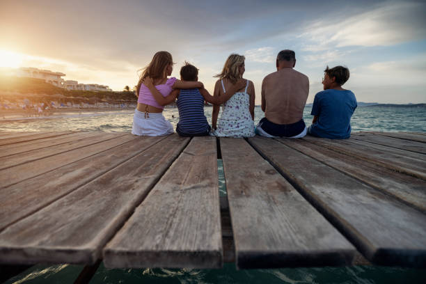 istock Multi generation family enjoying summer vacations 1351067410