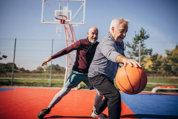 istock Senior men playing basketball 1351067742