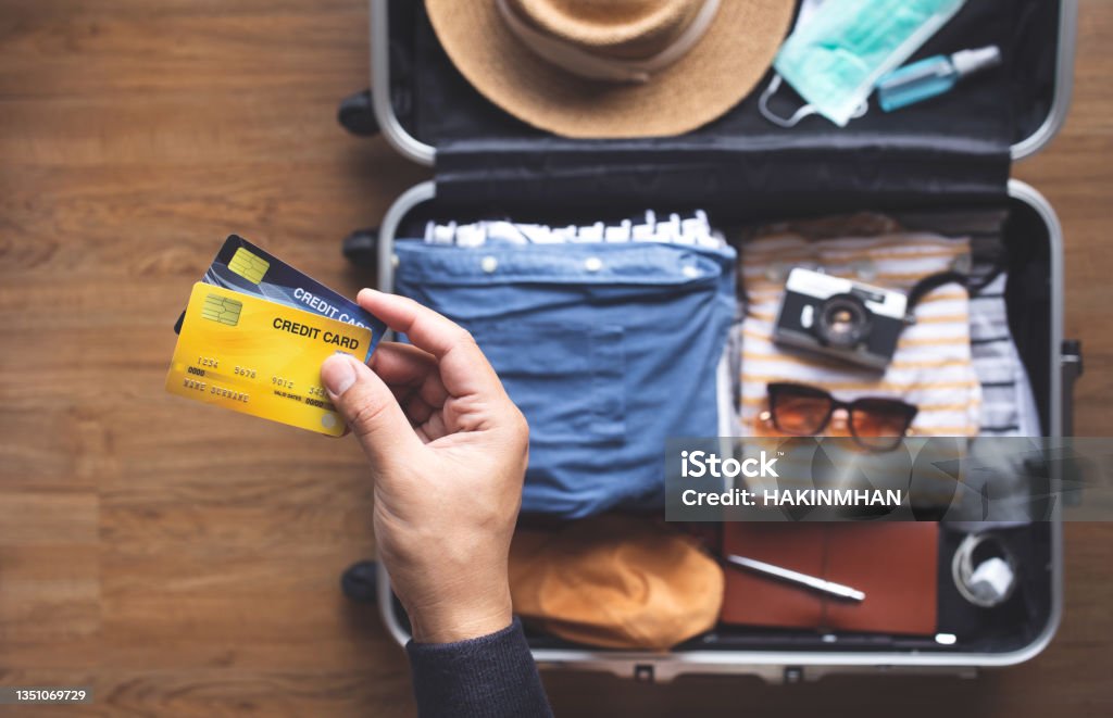 Young person using credit cards for payment on vacation or holiday trip.convenient  lifestyle with technology. Young person using  credit  cards for payment on vacation or holiday trip.convenient  lifestyle with technology.banking and financial Credit Card Stock Photo