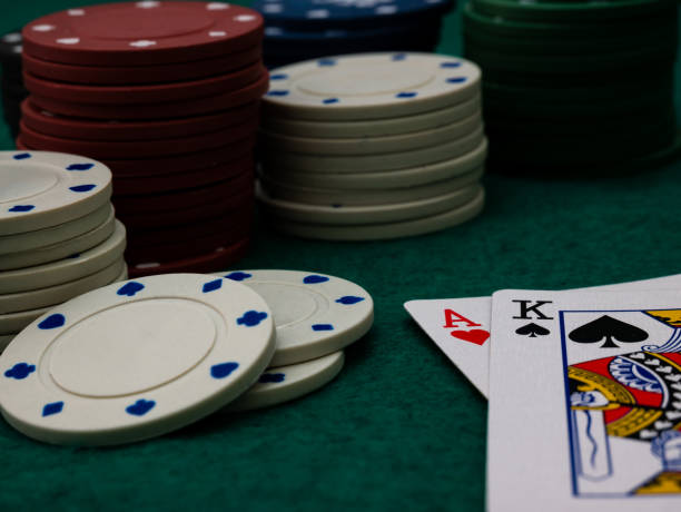 istock poker game table, ace and king card score with stack of playing chips 1351071555