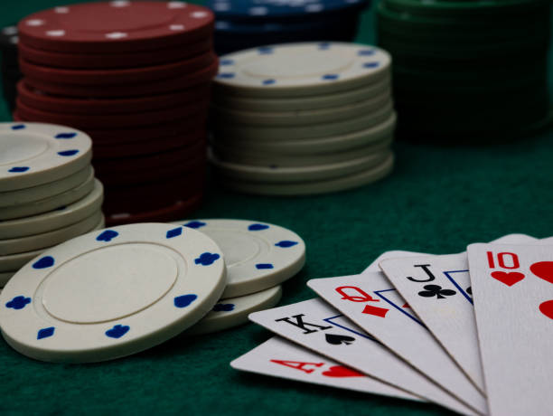 istock Royal straight flush poker cards with stack of poker chips 1351071566