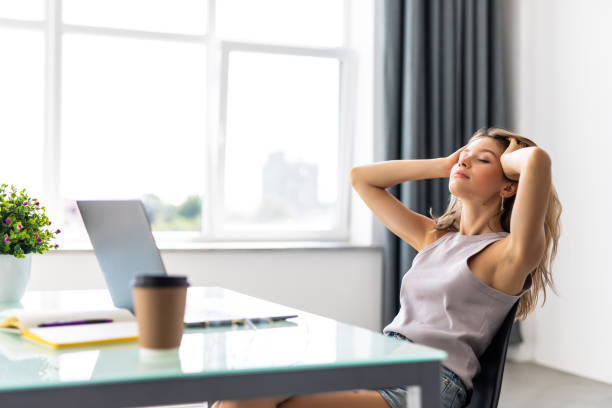 istock Young woman relax at her working place in modern office. 1351072513