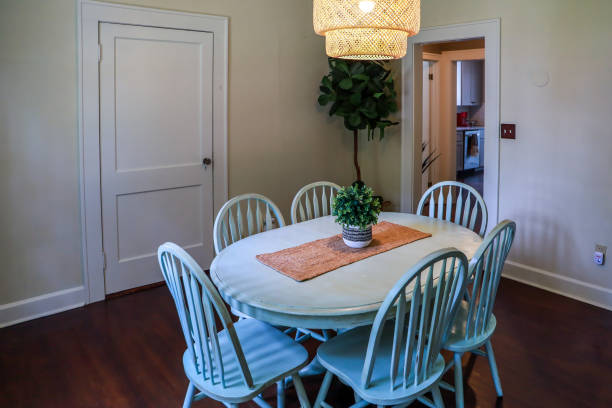 istock A small dining room with a statement rattan lighting ficture and a painted blue dining room table 1351073053
