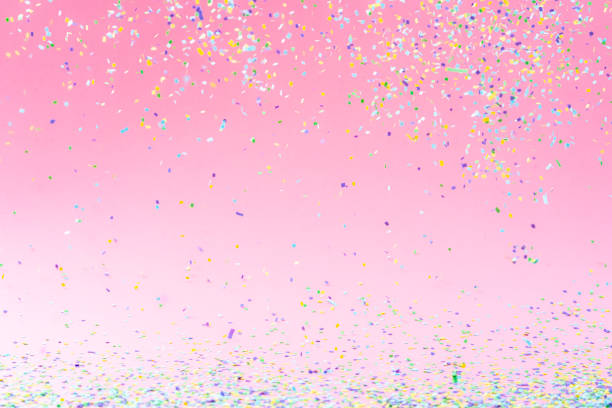 istock Celebration backgrounds: confetti on pink background 1351073226