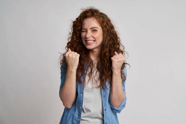 istock Young woman showing winning sign 1351074243