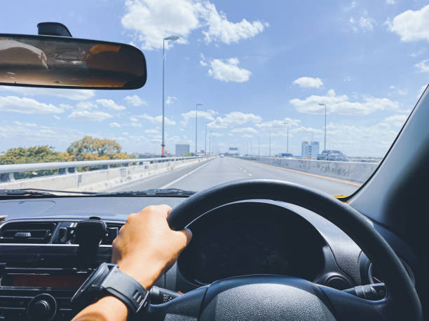 istock driving on the road, drivers point of view. 1351075643