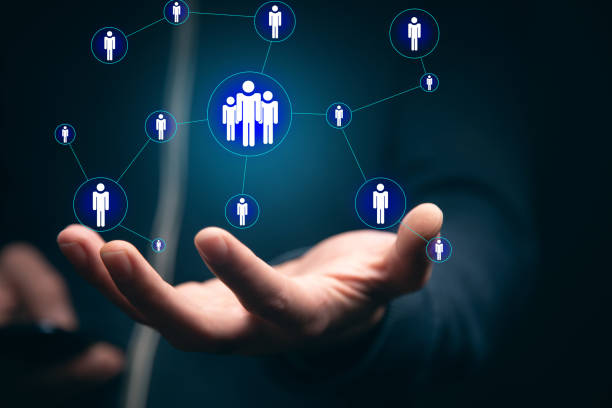 istock man holding phone with  people icon 1351077315