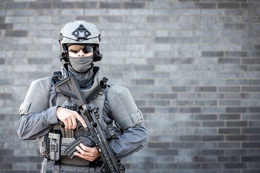 Portrait of Swat Police Officer Holding Firearm.