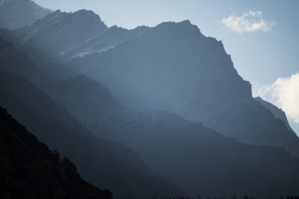 istock Hazy layered mountain peaks in morning 1351077431