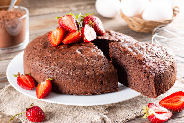 istock Chocolate sponge cake with strawberry on a table 1351078009