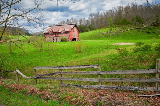 istock Old Kentucky barn with fence in the foreground. 1351079709