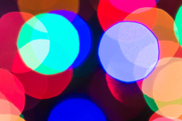 istock Beautiful abstract with defocused lights on black background 1351079911