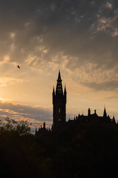Sunset over a silhouette of Glasgow University stock photo