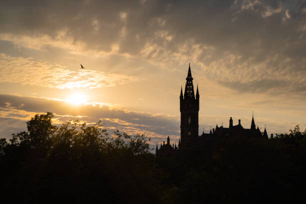 Sunset over a silhouette of Glasgow University stock photo