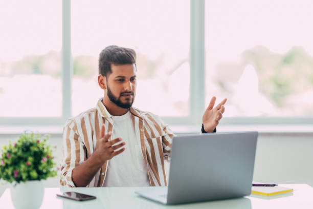 istock Indian business man is frustrated on a table with a laptop 1351082019