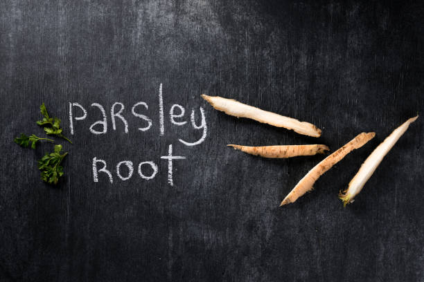 istock Image of parsley root over dark chalkboard background. 1351084021