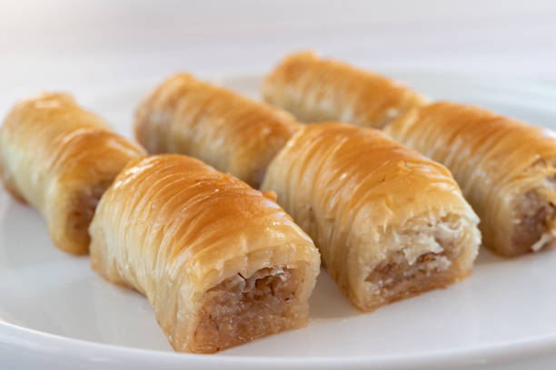 istock Turkish sweetness - baklava on a white plate close-up. Selective focus. 1351084375