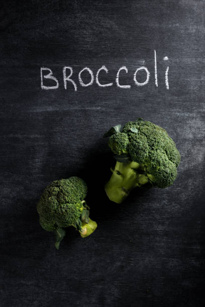 istock Picture of broccoli over dark chalkboard background. 1351085720