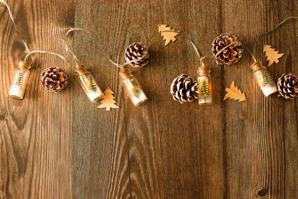 istock Concept - Christmas wood background with lights and tree with copy space, flat lay 1351085813