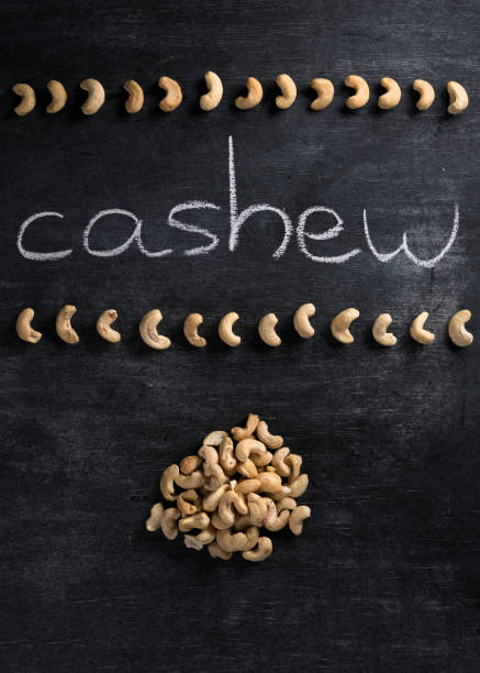 istock Cashew over dark chalkboard background 1351086430