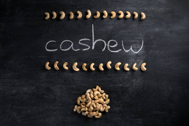 istock Cashew over dark chalkboard background 1351087334