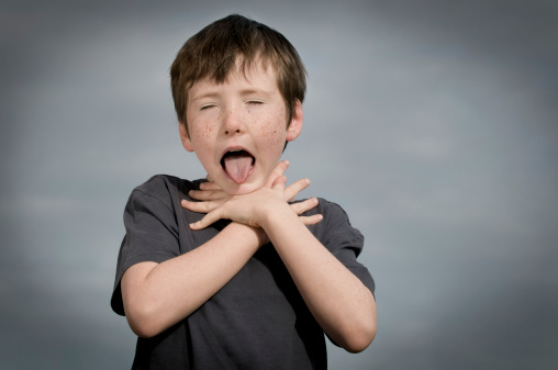 young boy suffocating with grey clouds