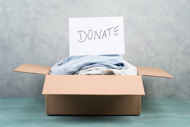 istock Package with used clothes for donation, second hand use for poor people, welfare 1351089533