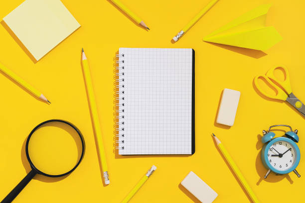istock Stationery pattern. School supplies on a yellow background. 1351093489
