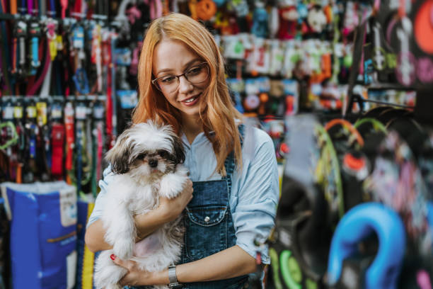 istock Woman in pet shop 1351093797