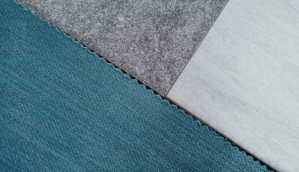 istock close up interior design mood board consists light blue or cyan woolen fabric, stone tile, travertine tile samples with blank space for design. 1351095498