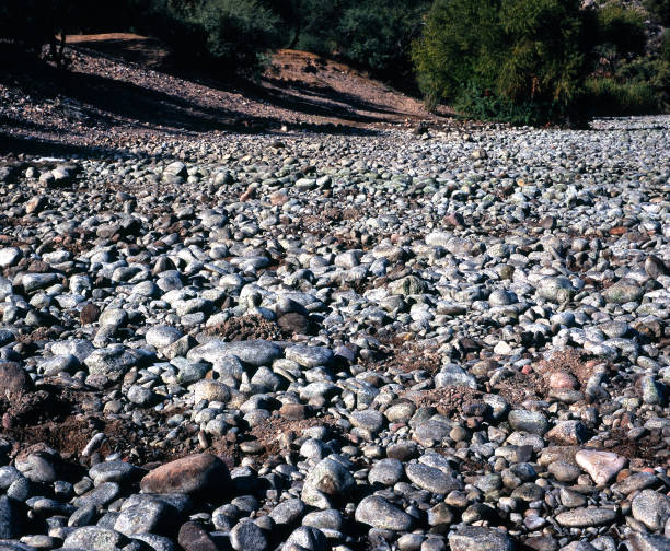 Thousands of stones lining a river bank and bed
