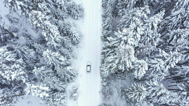 istock Car driving on winter country road 1351096946