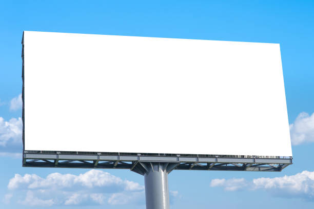 istock Large Blank Billboard with empty screen and beautiful cloudy sky 1351102180