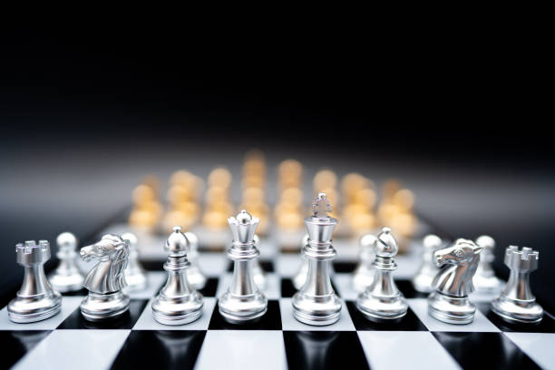 istock The battle chess sport game stand on chess board 1351102561