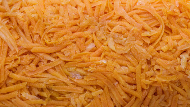 grated carrots after defrosting. harvesting vegetables for the winter. vegetables close-up. - defreeze imagens e fotografias de stock