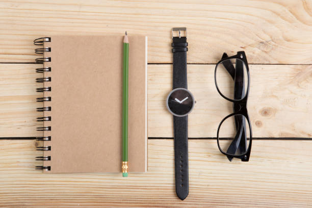 istock Blank notepad with pen and pencil on office wooden table 1351107436
