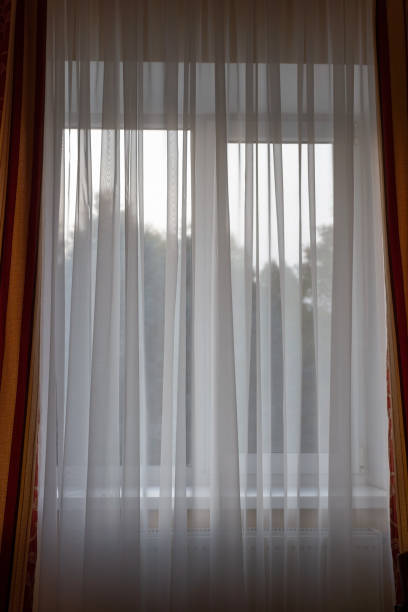 istock white curtains with a view and windows 1351107833