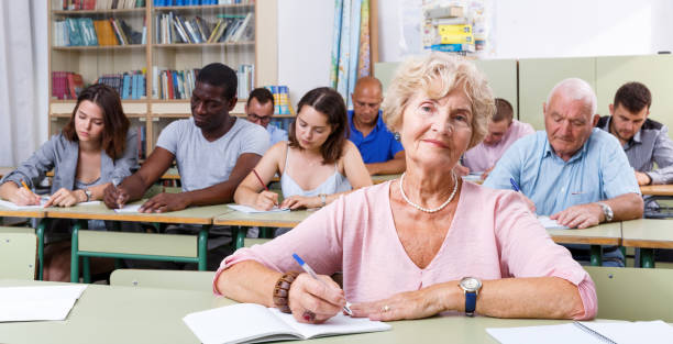 istock Mature woman take a written exam 1351108968
