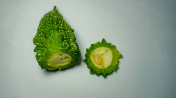 istock Fresh bitter melon on white. Healthy bitter melon for human body. 1351109912