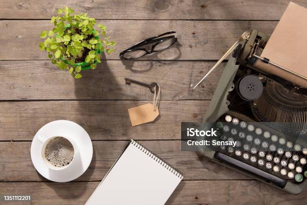 Vintage Typewriter On The Old Wooden Desk Stock Photo - Download Image Now - Publisher, Letter - Document, Note Pad